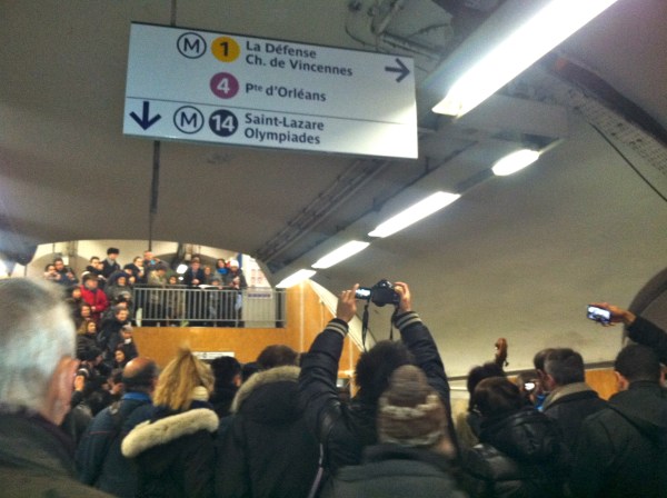 People at the Metro Station excited to listen to a group of classical musicians. 